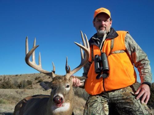 Man with a hunted deer